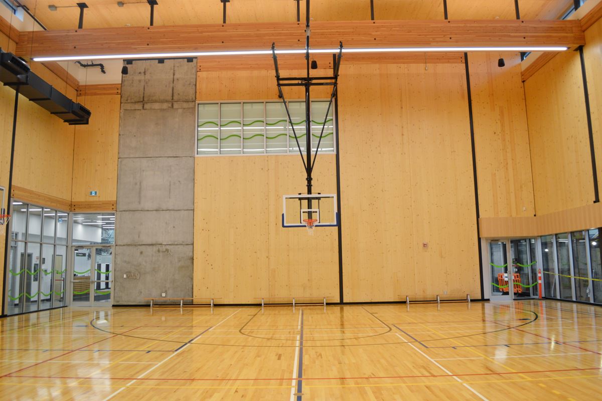 Photo of the Maillardville Community Centre Gymnasium with basketball hoop