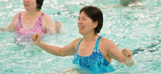 Adult participating in an aquafit class