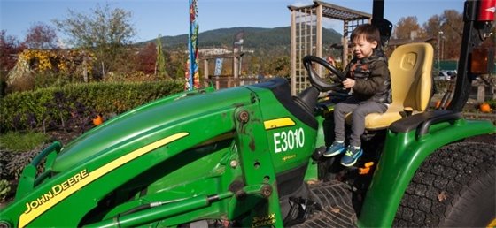 Child sitting on a tractor