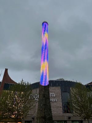 LED light column illuminated with spring colours blue, pink and yellow.