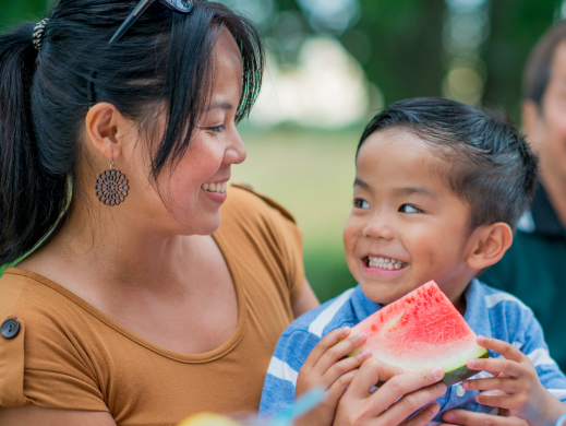 Adult and Child Eating Watermelon