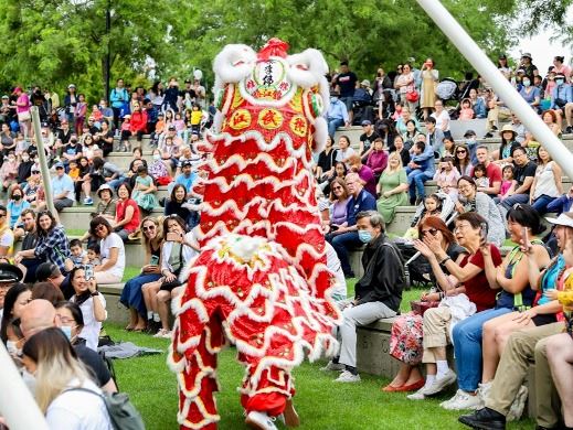 traditional Chinese dragon dancing in a crowd at Town Centre Park