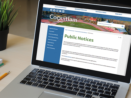 A laptop open to a Pulic Notices page on the Coquitlam's website