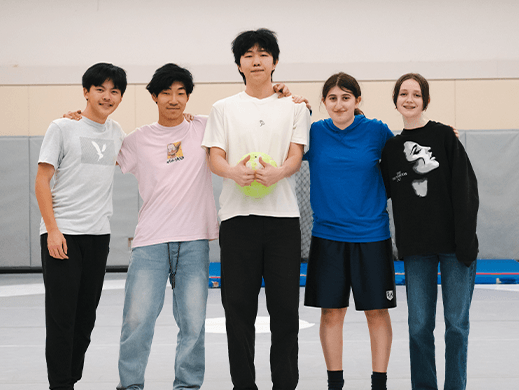 A group of youth line up for a photo 