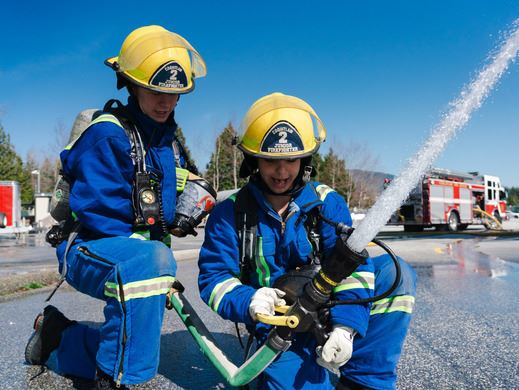 Two students participate in the Junior Firefighter Program.