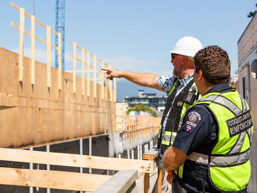 A Coquitlam bylaw enforcement officer visits a construction site.