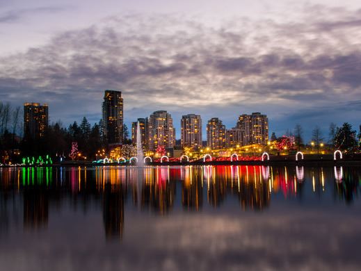 Lafarge Lake at dusk with a sunset and seasonal light display