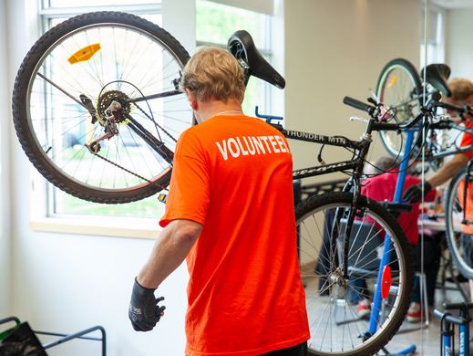 Repair Cafe volunteer fixing a bicycle
