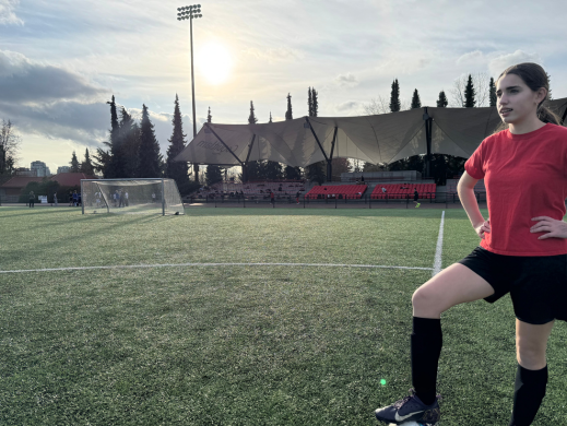 A kid posing with a soccer ball at Percy Perry Stadium 