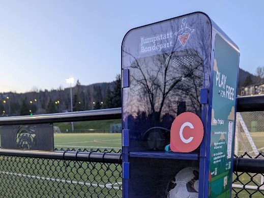 Equip Sport box with sports equipment at a Town Centre Park backdrop