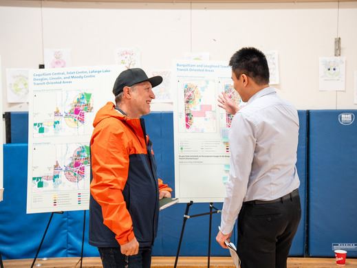 Individuals engaged in a discussion on city transit