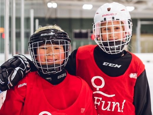 Two kids in skating lessons