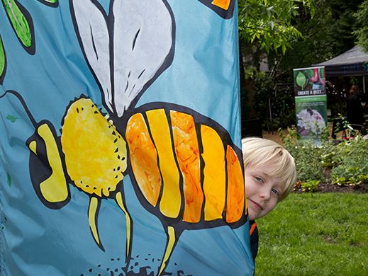 Coquitlam in Bloom Pollinators banner boy smiling garden bees