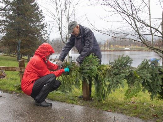 Volunteers installing lights and decorations