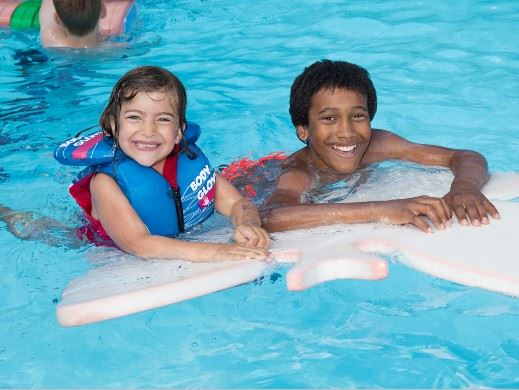 Two kids swimming