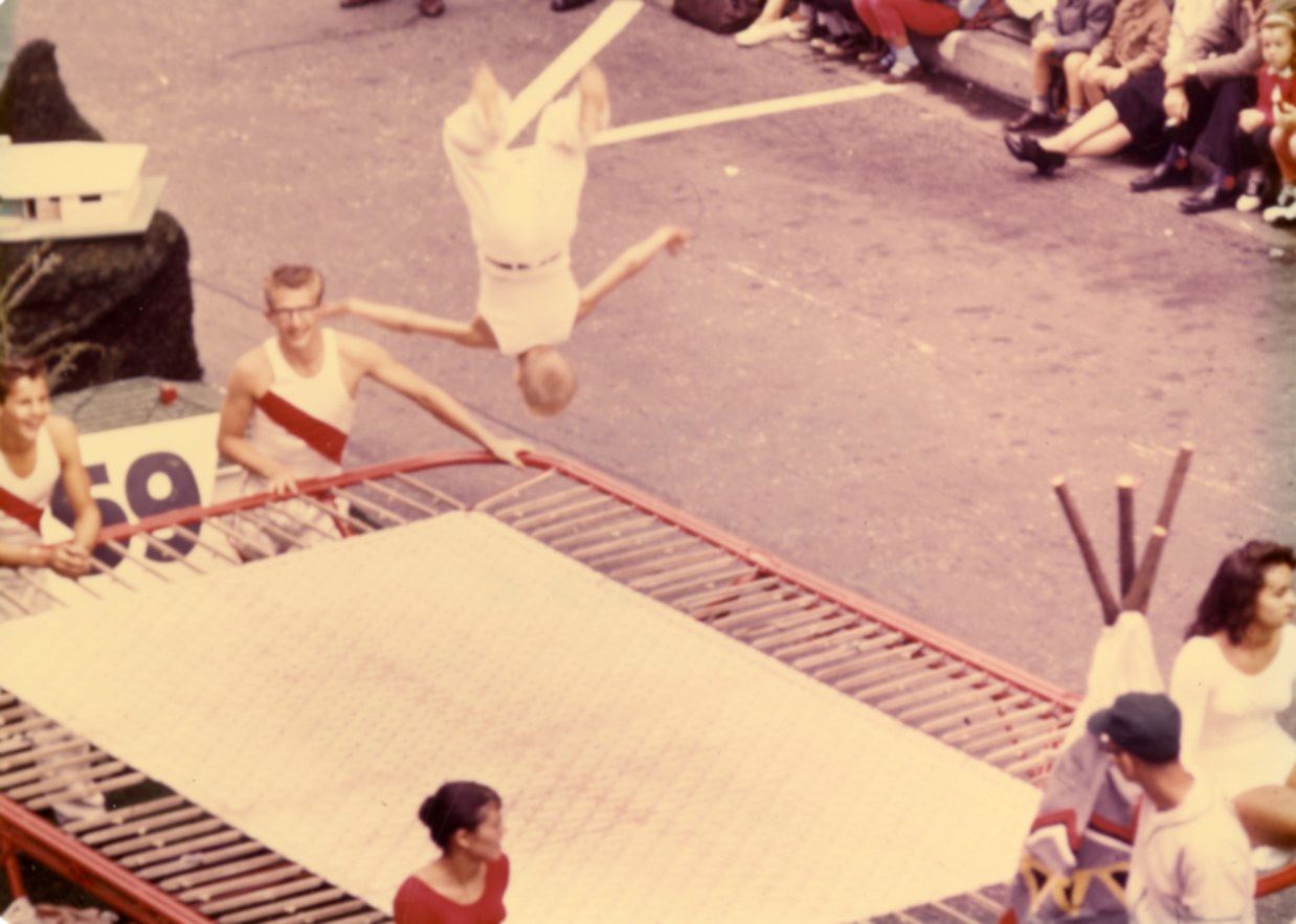 Don Cunnings with a trampoline on a parade float.