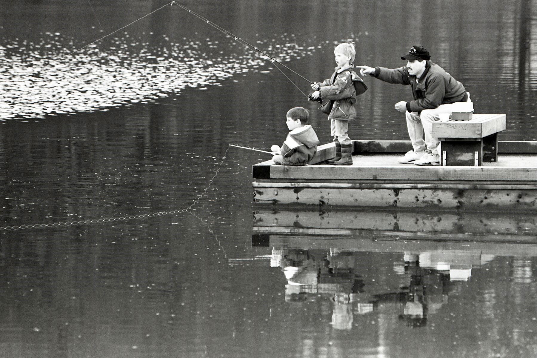Dad with sons Nicky and Tad Badger fishing at Lake Lafarge (Tri-City News fonds F13.1482)